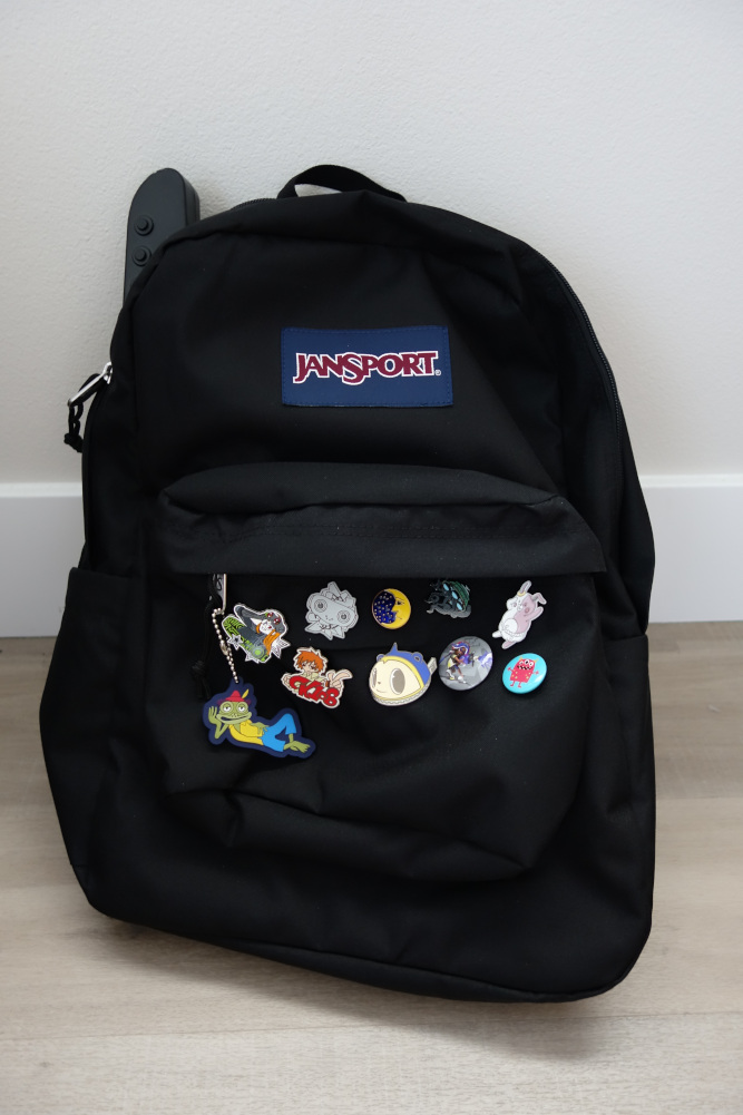 My backpack with all my pins on it.