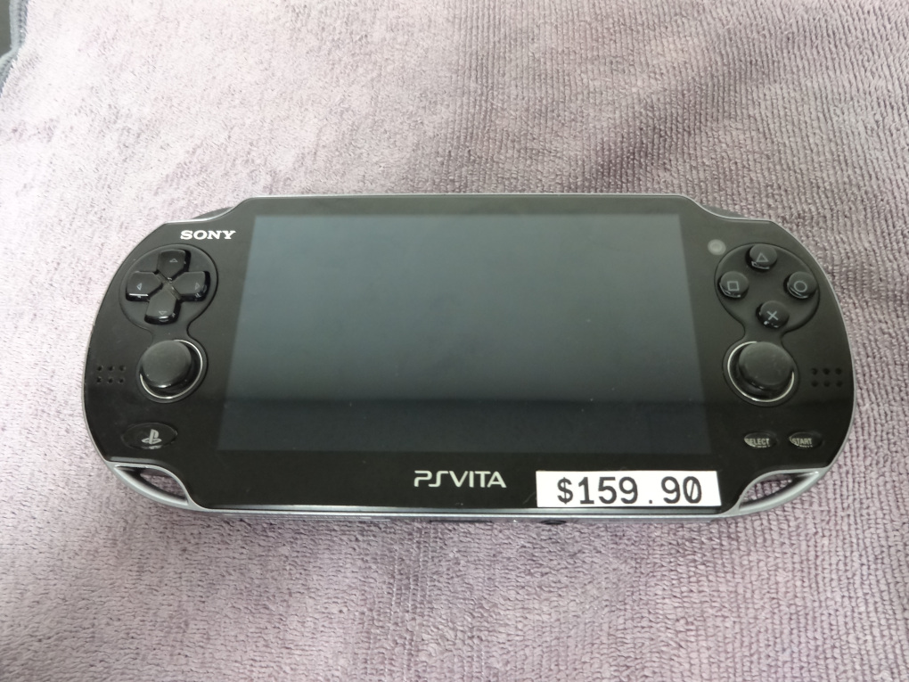 My PS Vita 1100 model, with a sticker that says $159.90